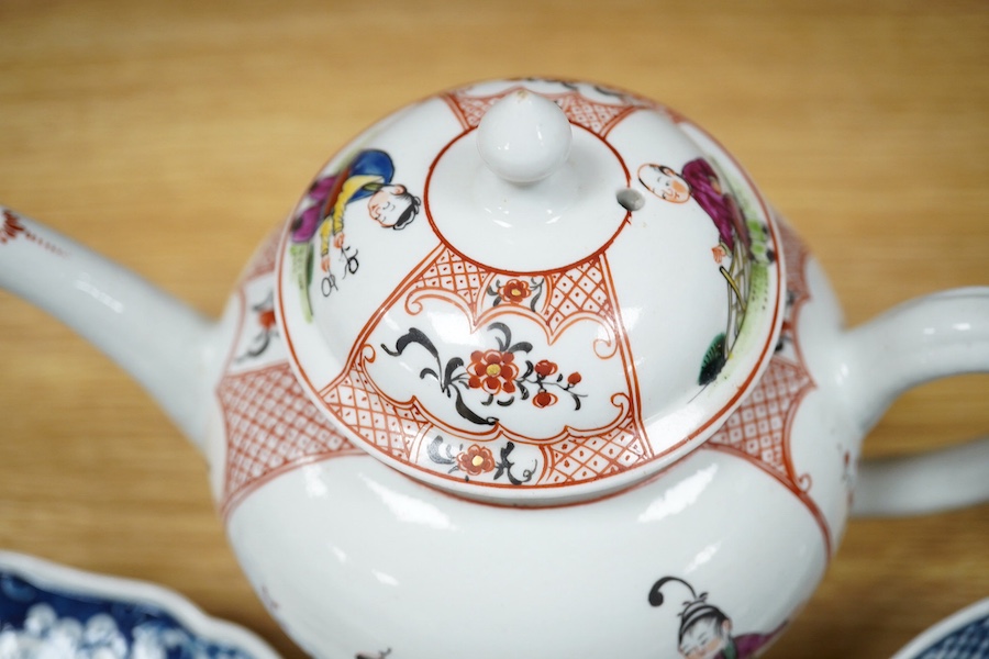 An 18th century Worcester Chinese style teapot, and a similar pine cone pattern strainer and plate (3). Condition - teapot cracked and chipped, others good